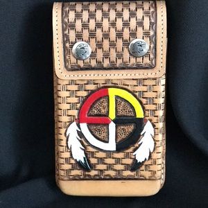 Handmade all leather cell phone carrier.